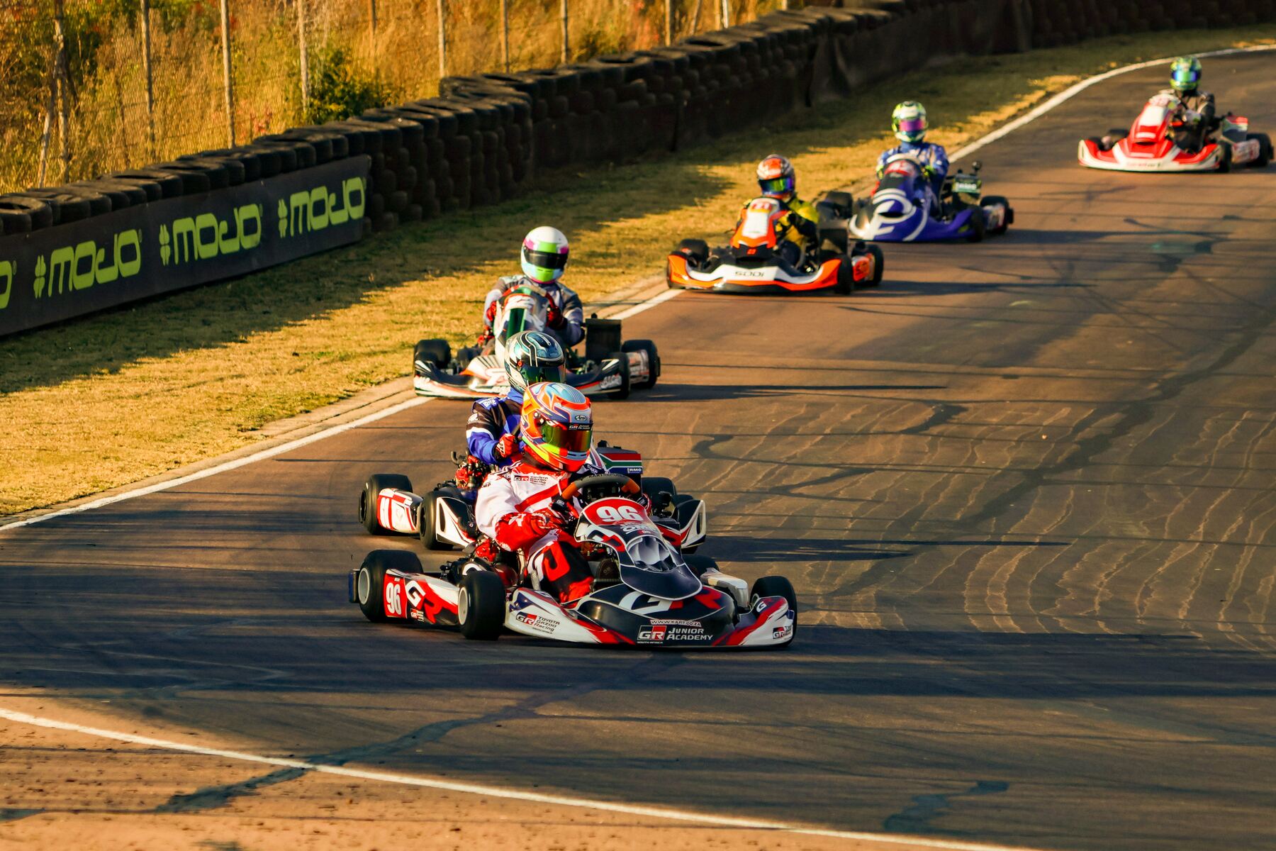 Jonno Wilson leading a pack of Rotax DD2 karts through a corner